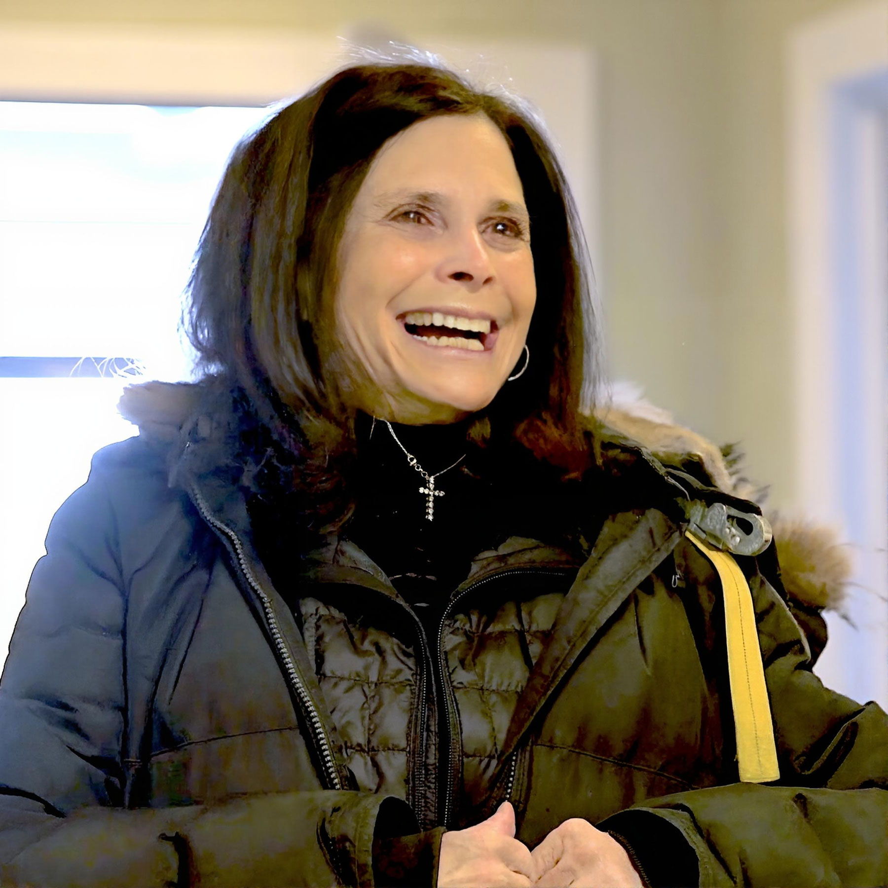 happy smiling patient at high country dentistry front desk in steamboat springs